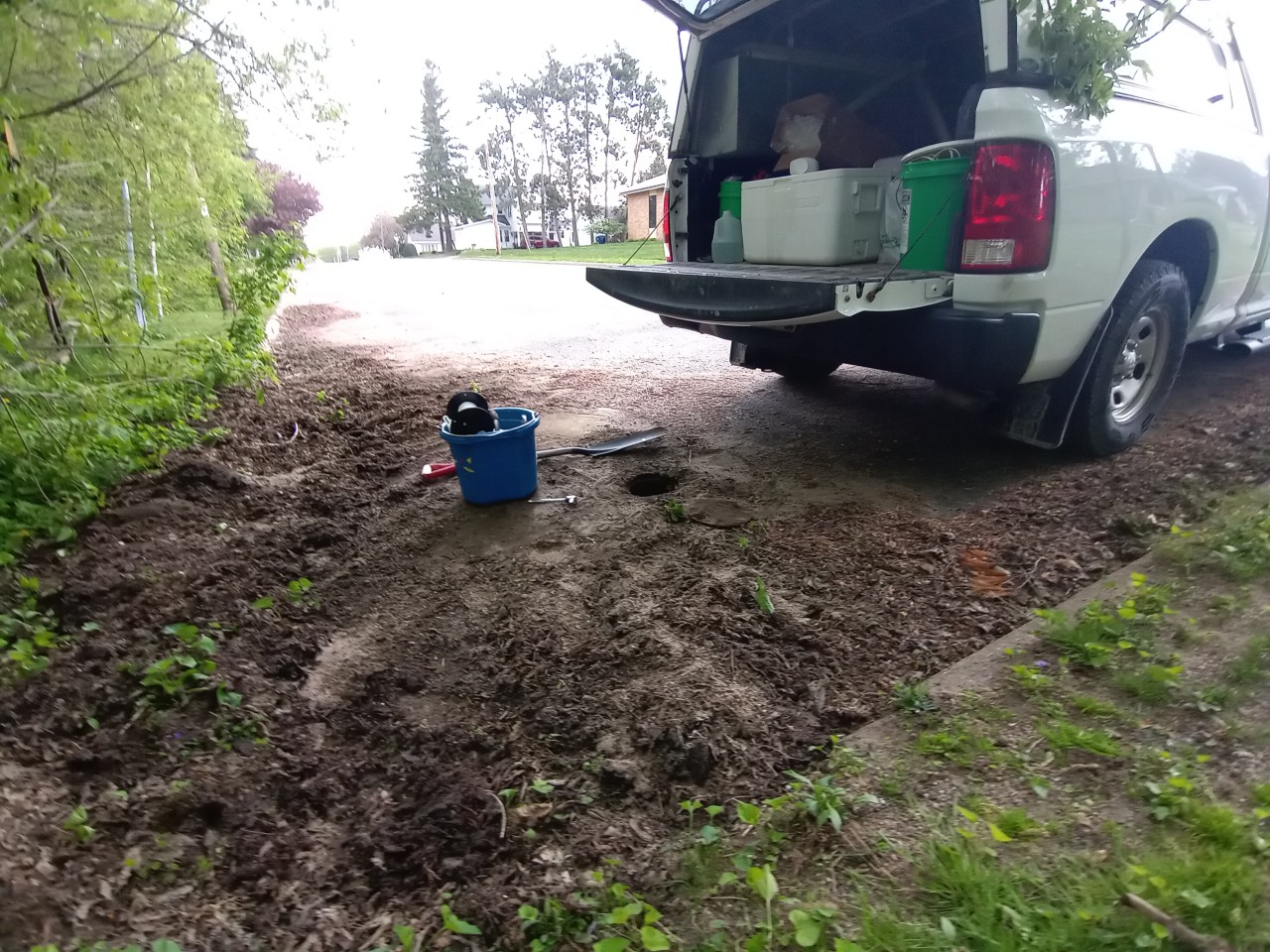 Hydrogeologists using groundwater monitoring equipment